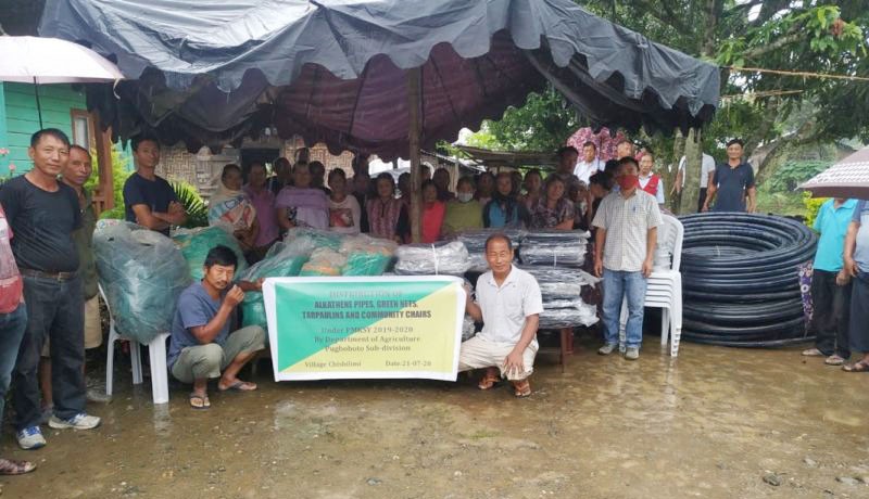 Beneficiaries with officials during the distribution programme held at Chishilimi under Pughoboto Subdivision under PMSKY project on July 21. (DIPR Photo) 